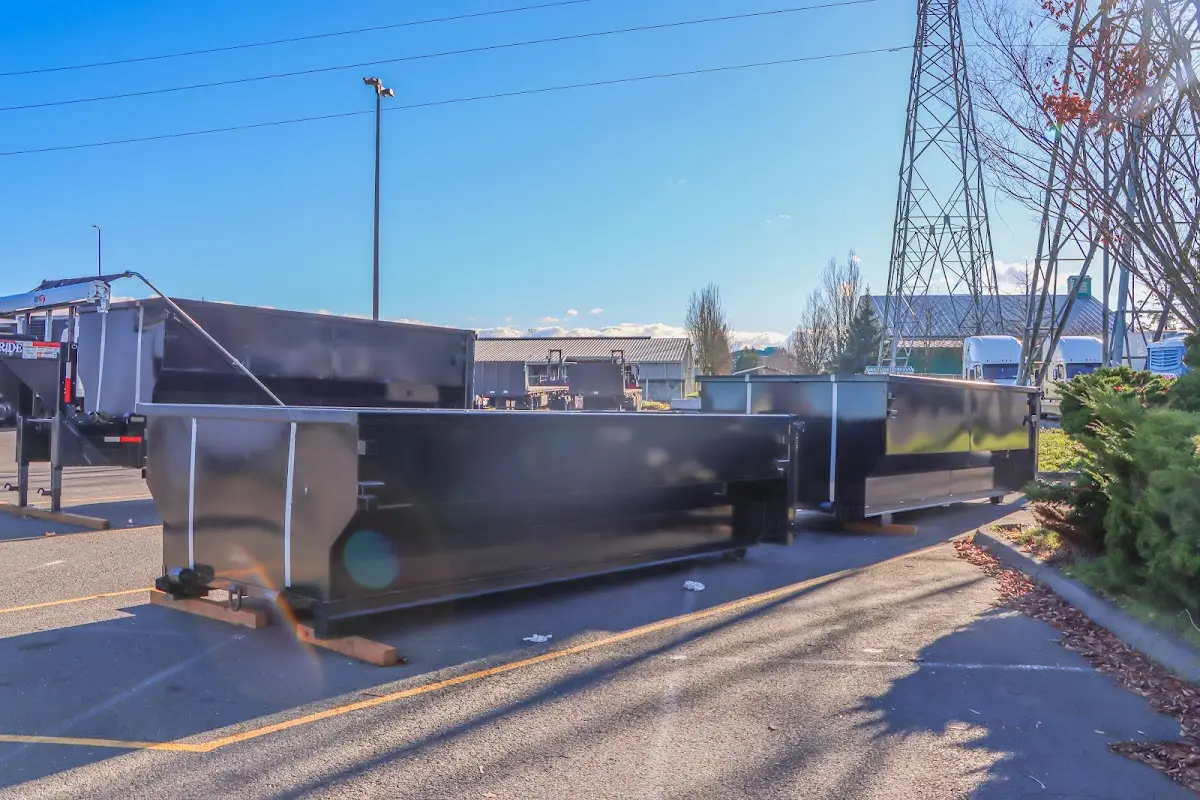 Roll-off dumpster ready for waste disposal at job site for Yard Waste Dumpster Rental in Southside